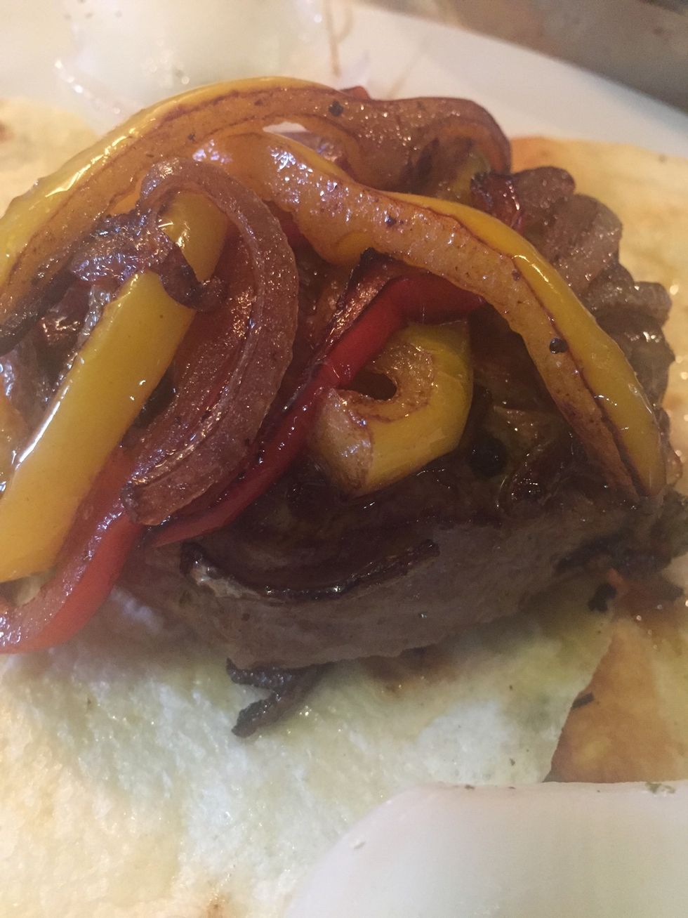 Voila !!!! Put the pita first then the steak with the peppers on a plate