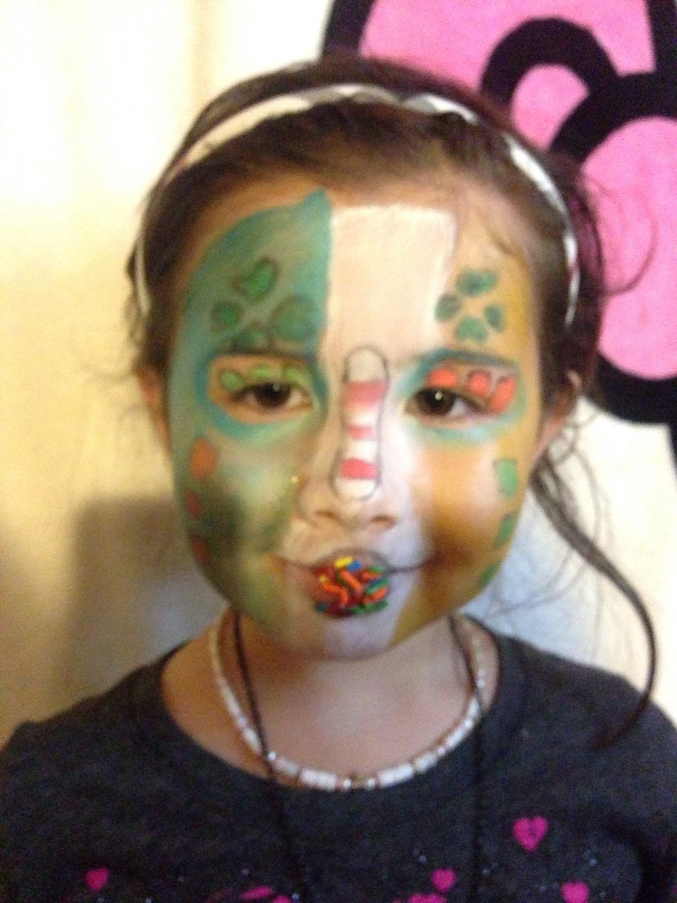 Voilah -4 leaf clover is above her eyebrow