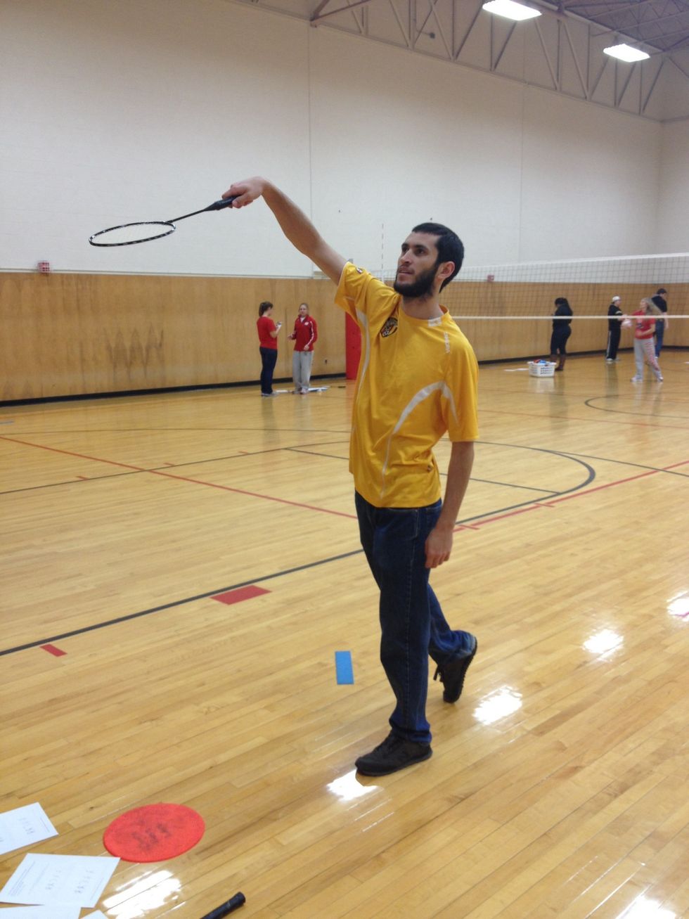 Wack the shuttle with as much force as possible, snap wrist, follow through down and across body