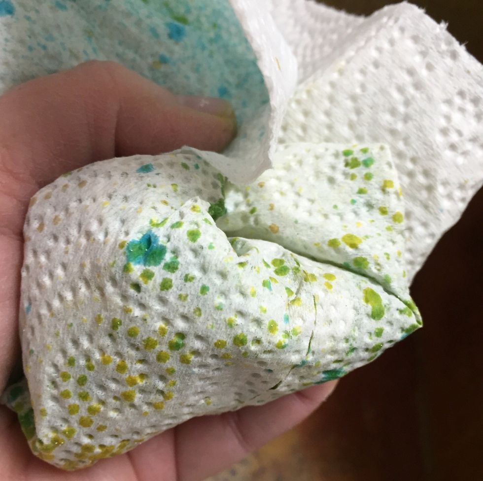 wad fringe up in paper towels and gently squeeze to press ink into fringe and to remove excess ink.