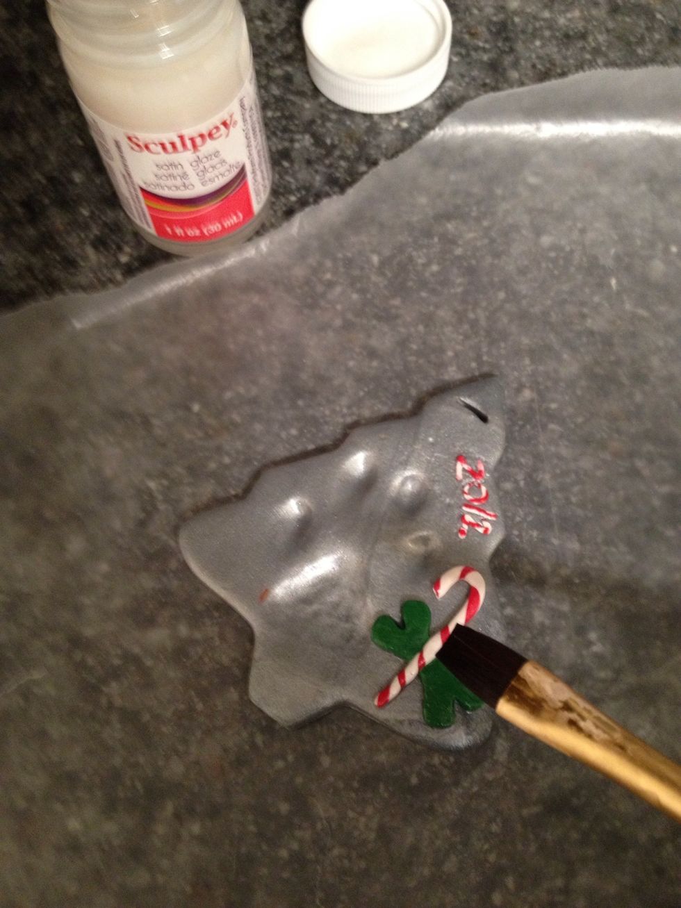 Wait about 30 minutes to let the piece cool and harden. Glaze with sculpey glaze, giving it 30 minutes to dry.