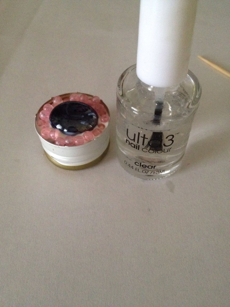 Wait for it to dry, then take your clear nail polish.