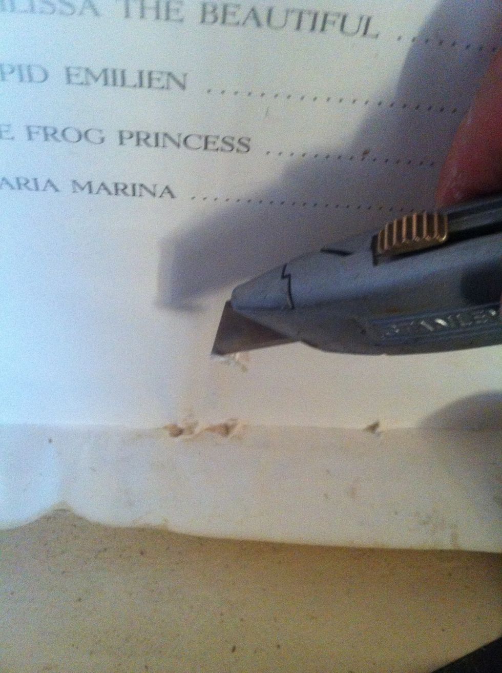 Wait till paper is dry before trimming, to avoid tears like these.