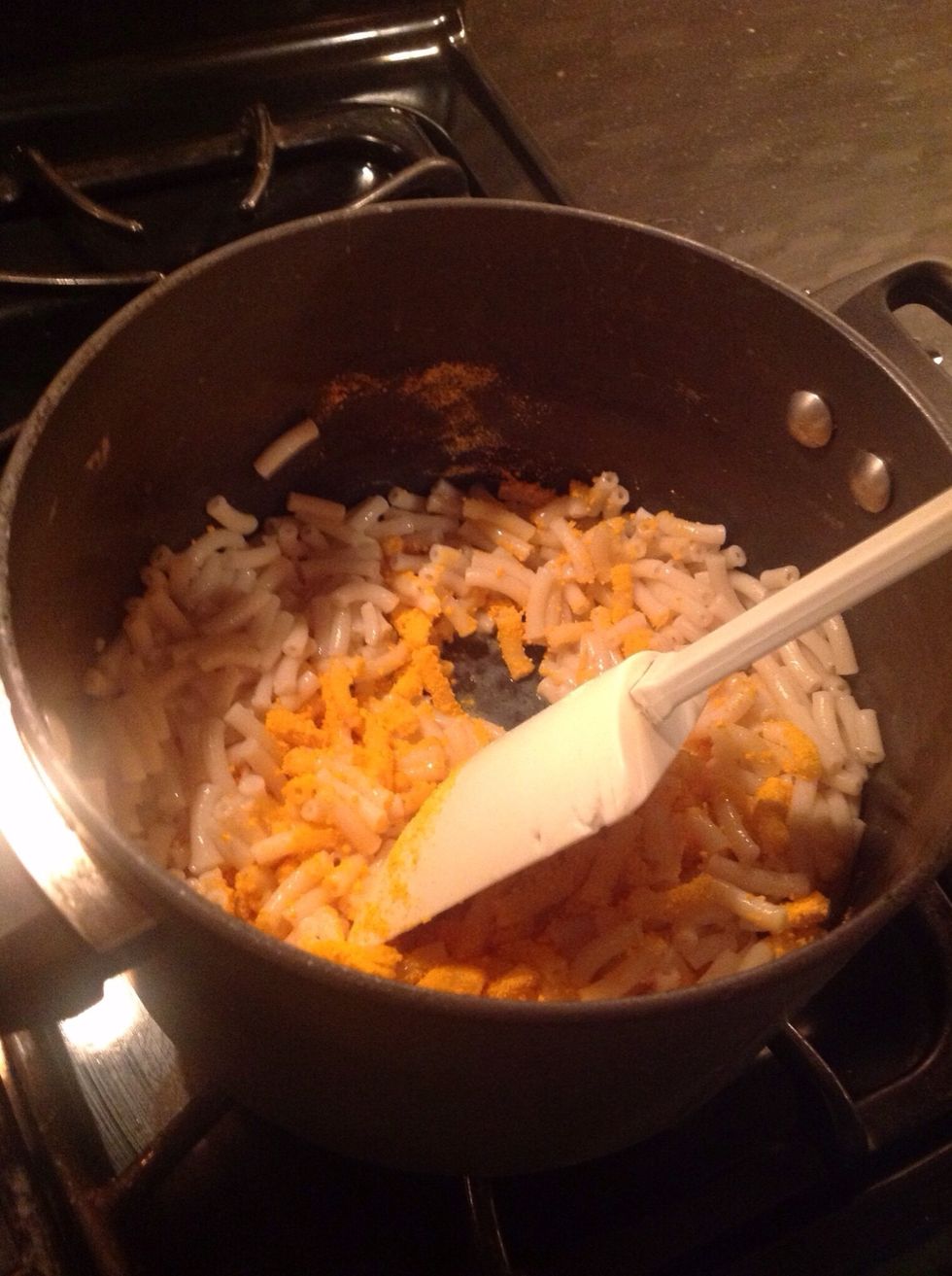 Wait until the butter and the milk have mixed in then add the cheese.