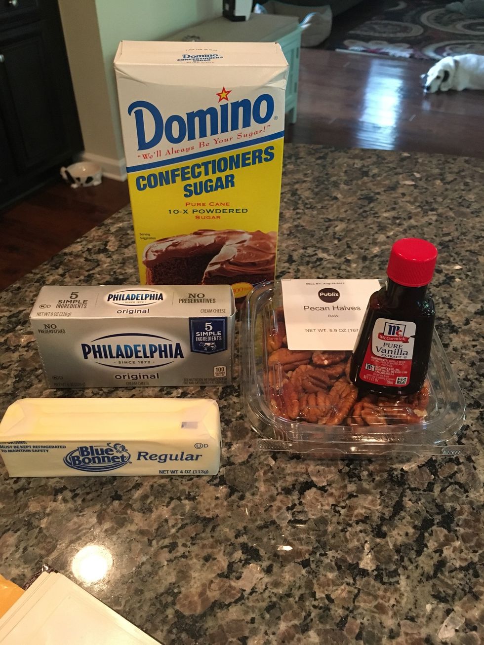 Wait until the cakes are completely cool before you begin making the icing. Start by grabbing the ingredients you need to make the cream cheese frosting.