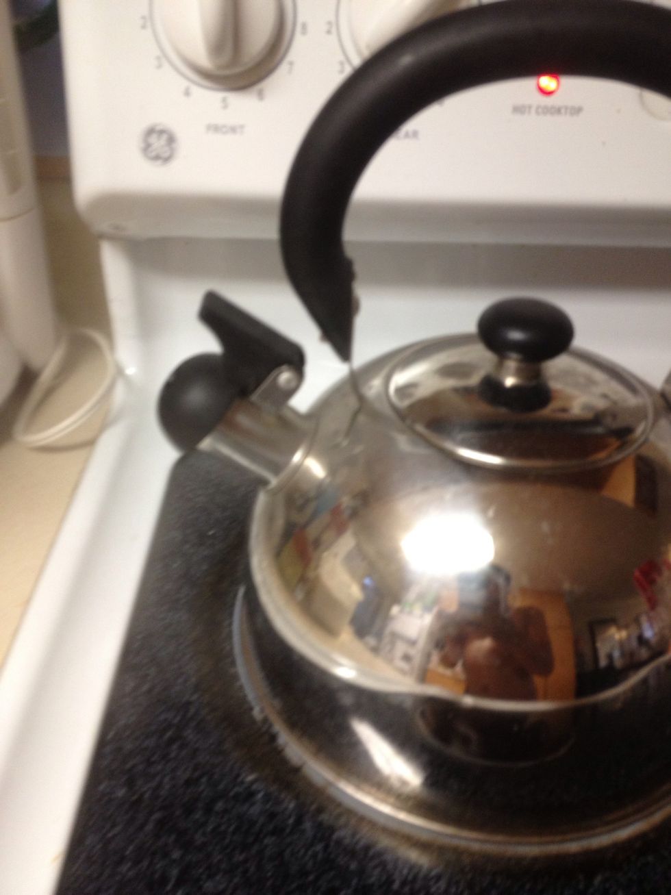 Wait until the kettle whistles, or comes to a running boil. Then pour back into pitcher, if heat resistant. If not, do step 5-7 in the kettle or pot.