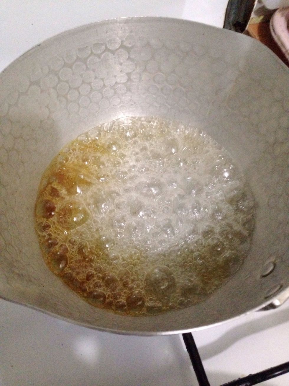 Wait until the sugar lightly colored like that then swirl the pot