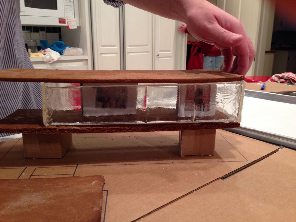 Wait, why doesn't the roof meet the glass? We ( and by we I mean Throckmorton) used many different measuring devices! I blame the gingerbread. That glass is perfect.