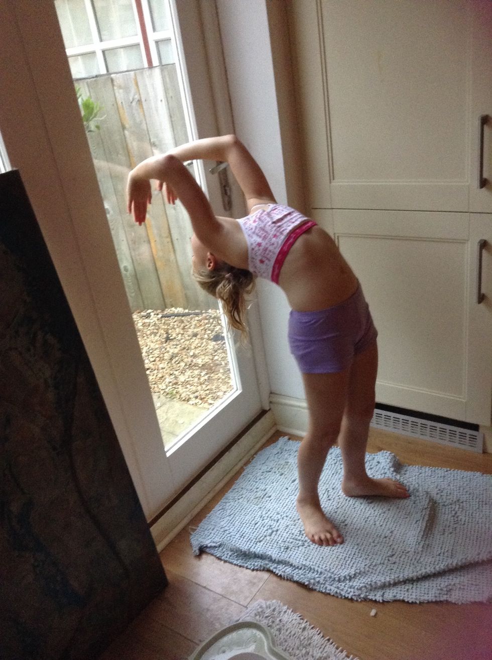 Walk down the wall or the door with your hands