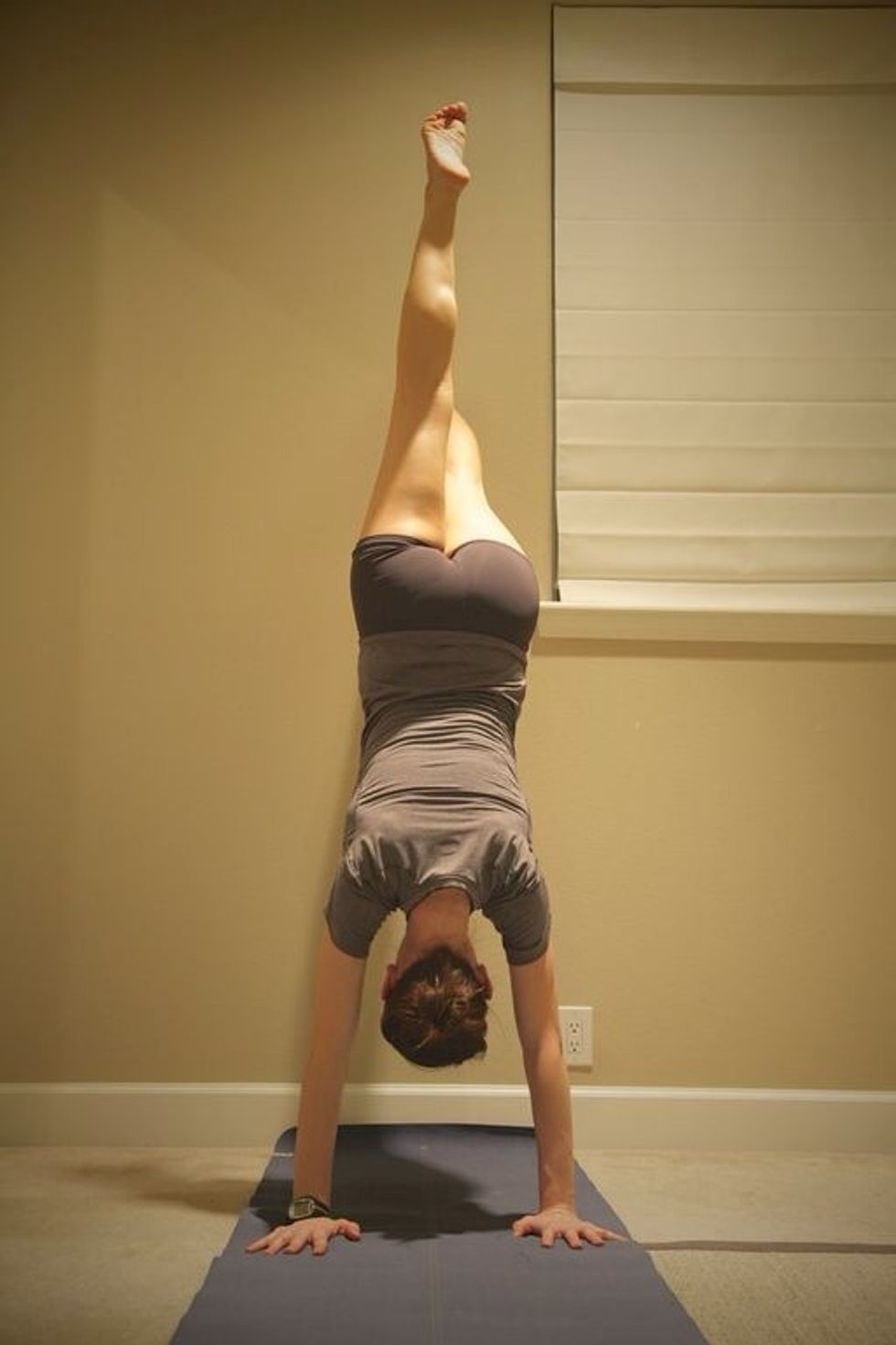 Wall Walks Part 2: alternate lifting one leg off the wall once you are almost in a handstand. Walk back down the wall. Complete as many as possible in 1 minute.