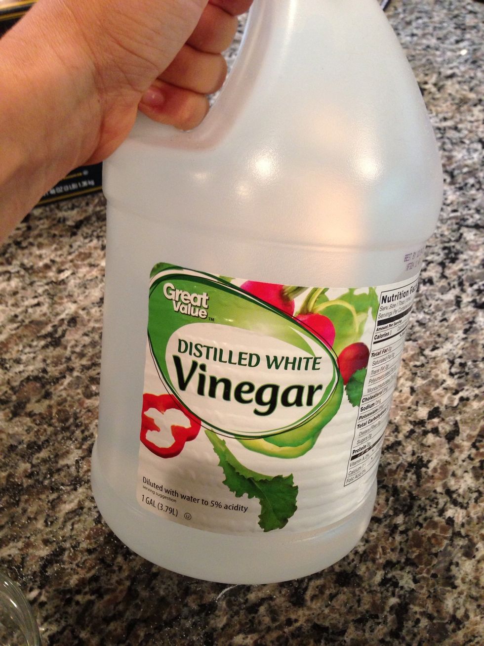 Walmart vinegar. Sorry Walmart haters. This is your rinse aid at about 2 cents a load. Whoa, your dishes will sparkle so much you'll think they proposed. (Don't accept, I heard they get around.)
