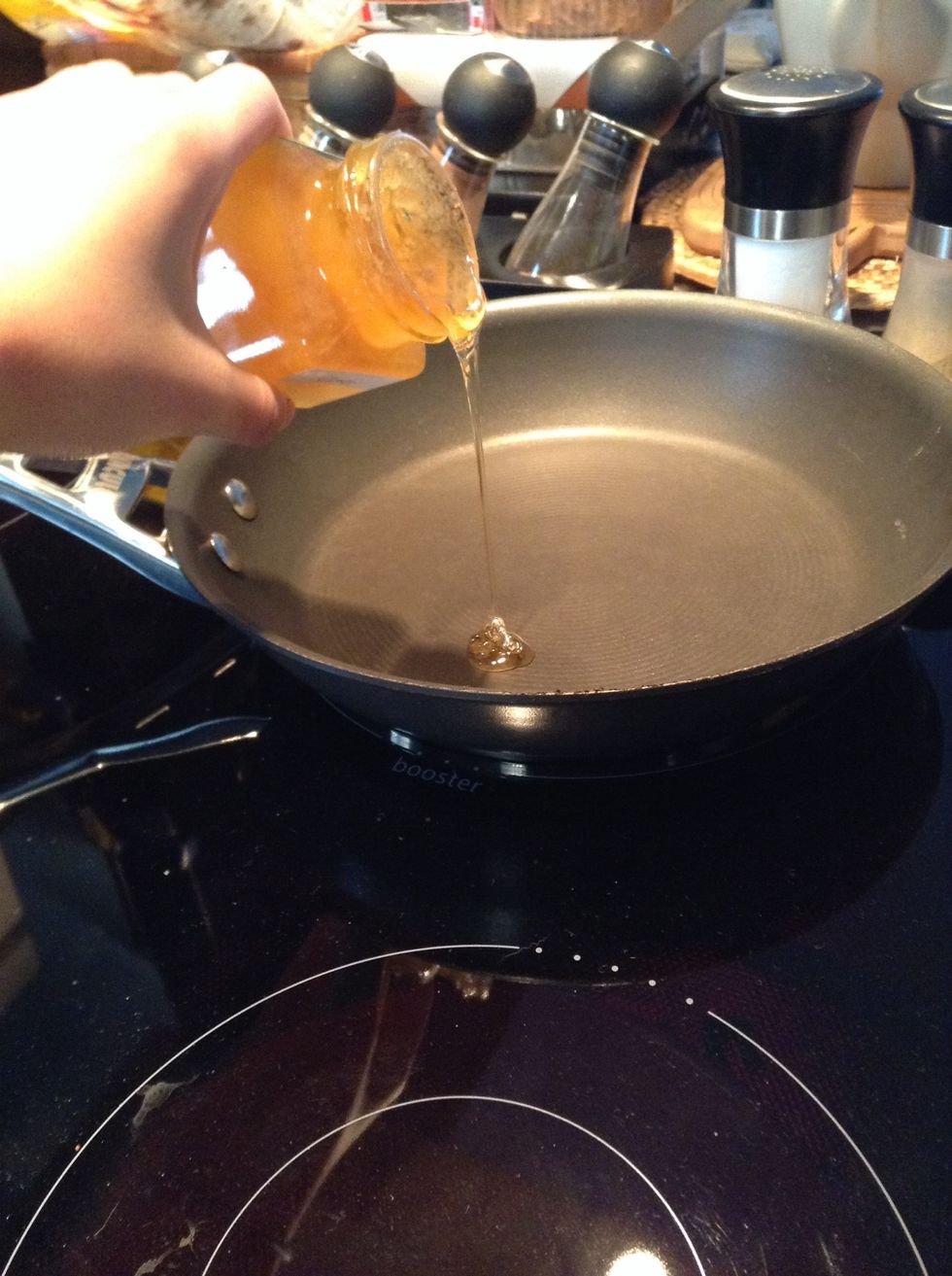 Warm frying pan and add honey.