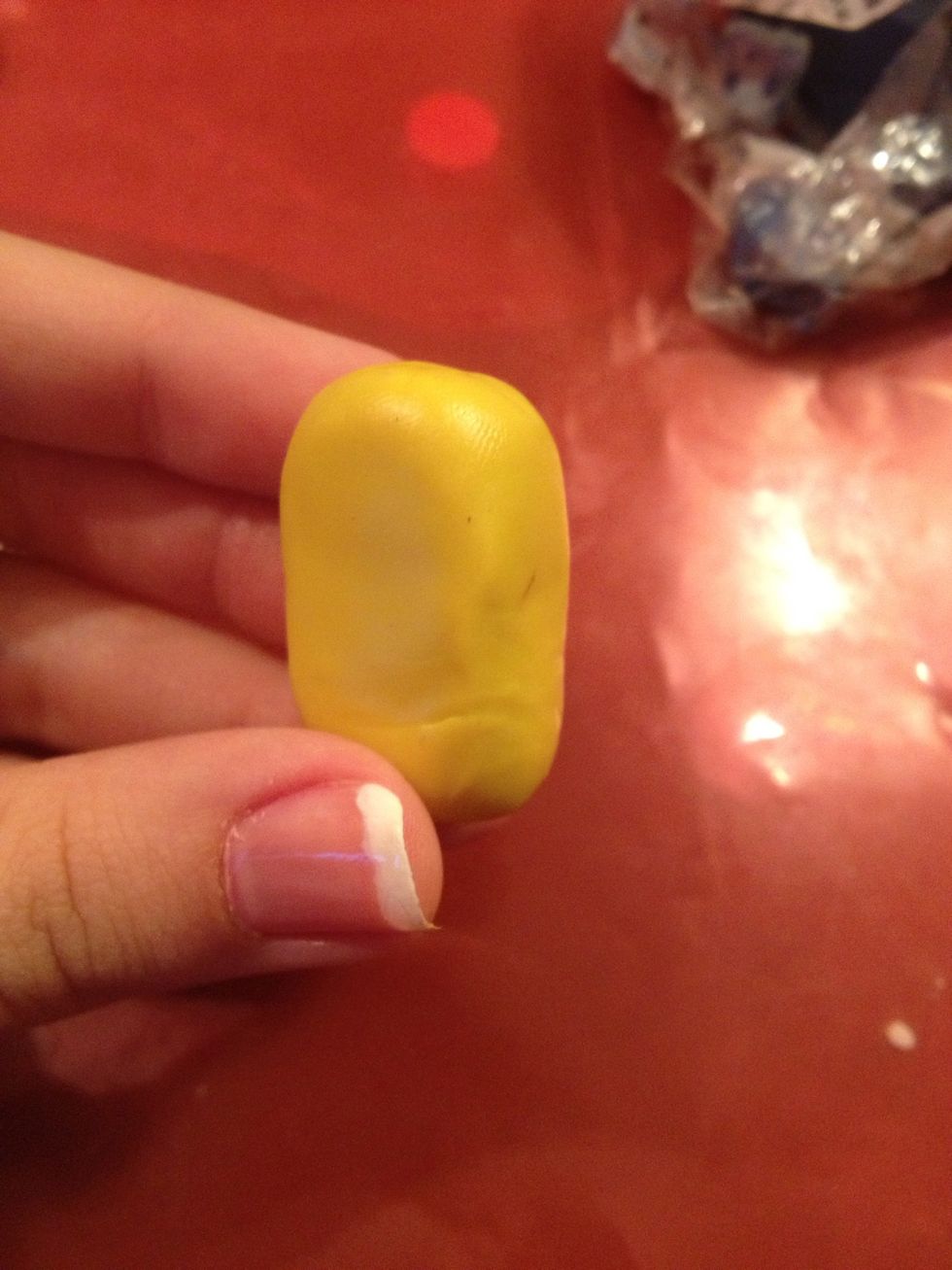 Warm it with your hands and make a kind of brick.