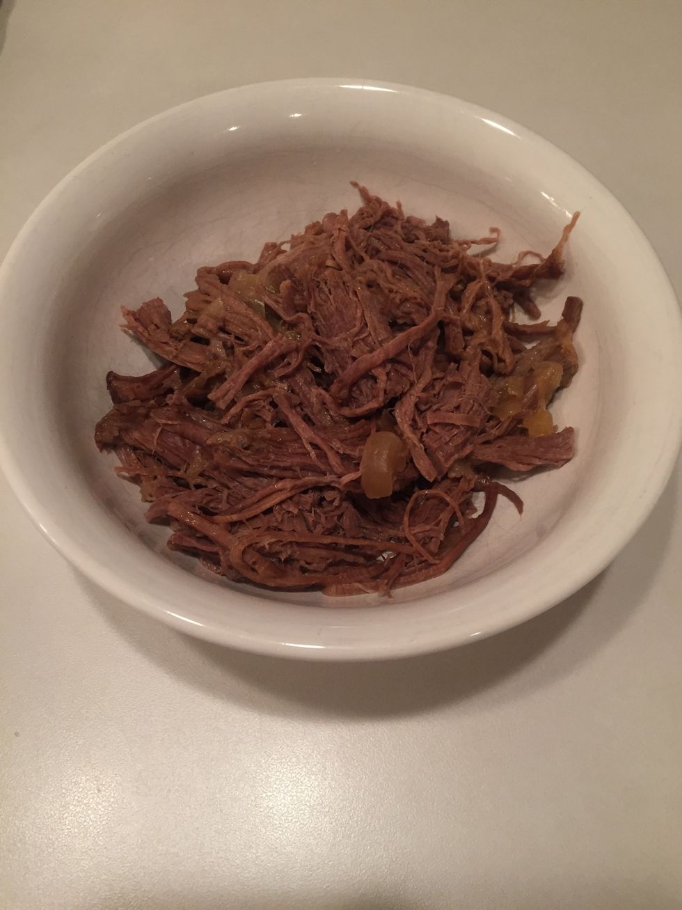 Warm leftover pot roast. Shred using two forks. Mine had some onion in it for extra seasoning.