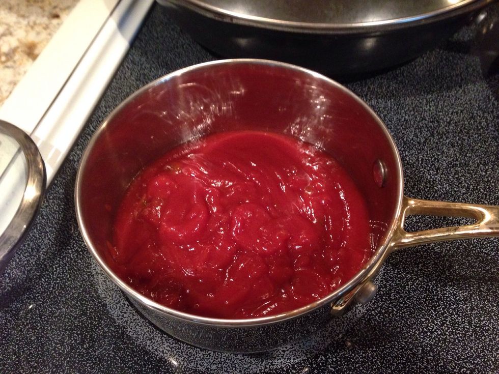 Warm the Manwich (or sloppy joe sauce) in a separate pan.