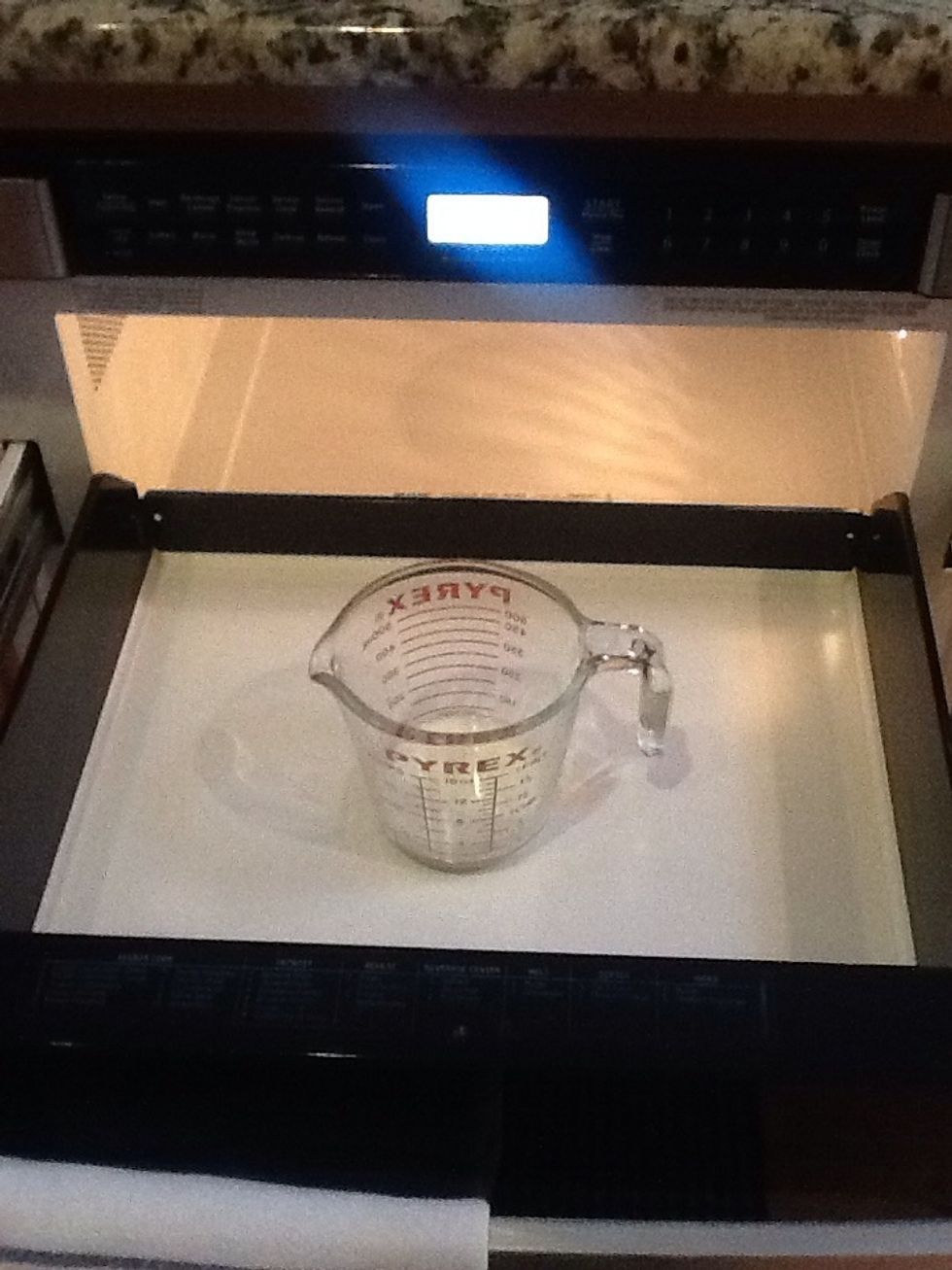 Warm the milk for 20 seconds in the microwave