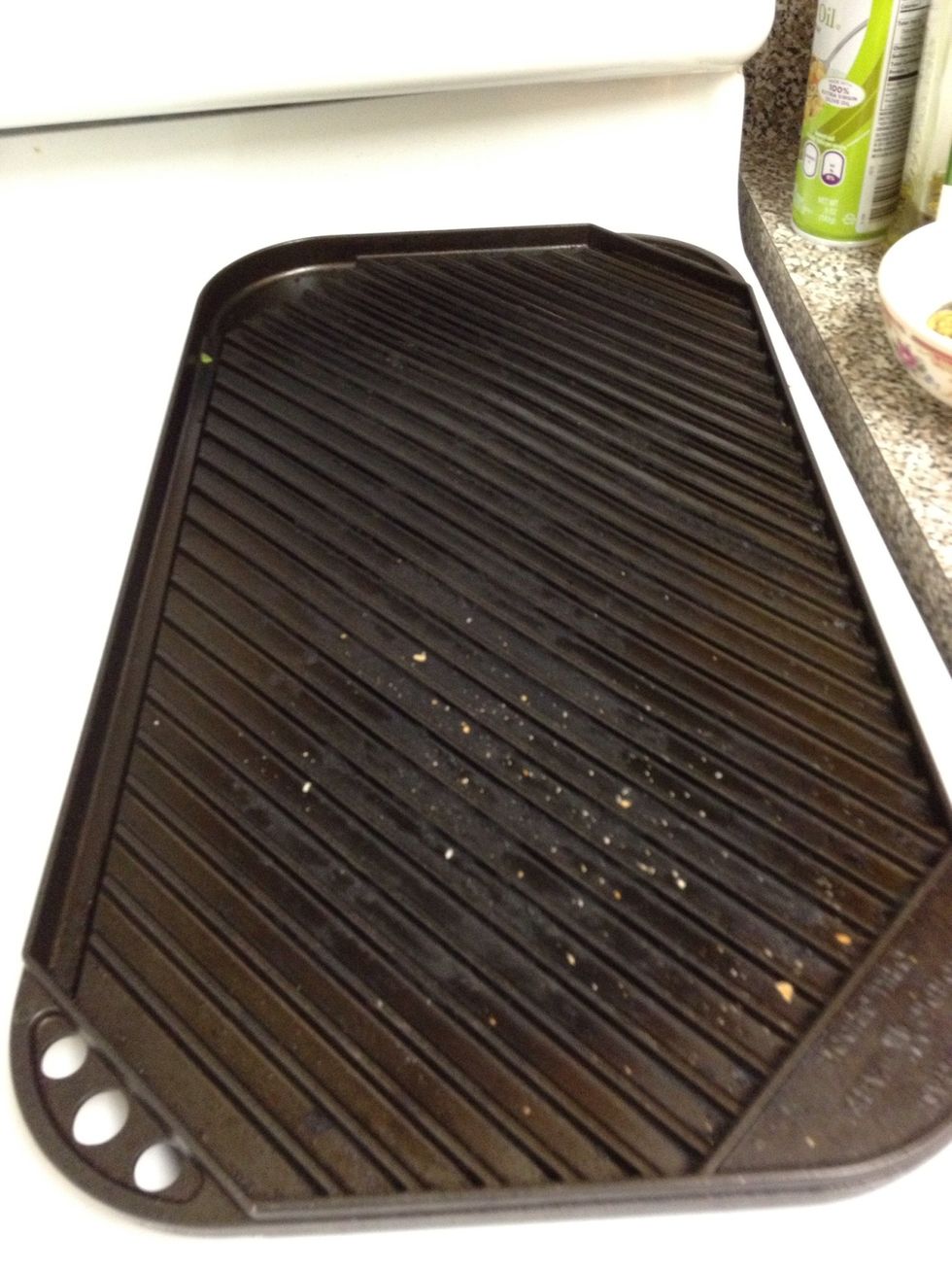 Warm up the grill or pan and spray it with cooking spray. We have a gas stove so this griddle/grill works fantastic in the winter.