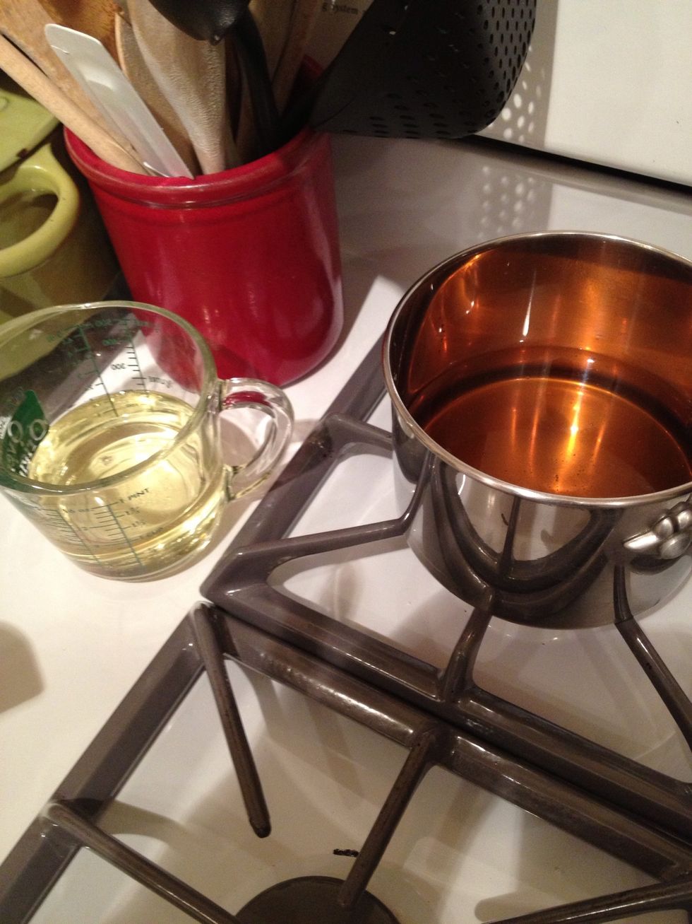 Warm up the honey, the hot water, and the vegetable oil on low heat, so that it becomes liquid and easy to pour. It will mix more evenly with the dry ingredients.