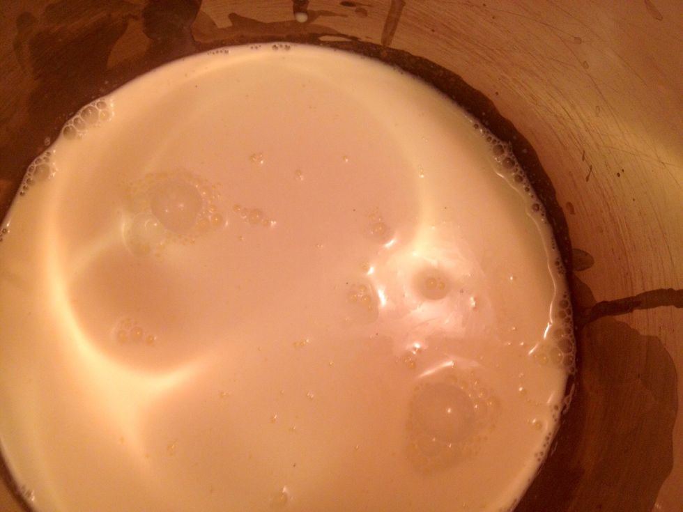 Warm up the mixture on low heat (don't let it boil). Remove the vanilla pod, use a spoon or a sharp knife to remove the vanilla seeds from the pod. Add the seeds to the milk/cream.