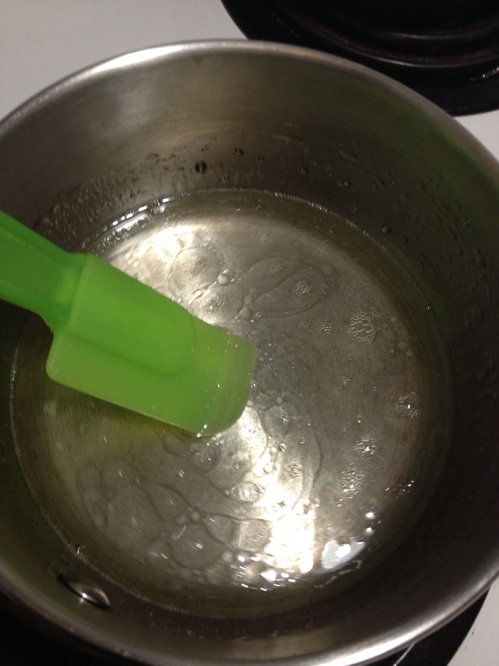 Warm up the water slightly and add oil and sugar. Mix until the sugar dissolves. You do NOT need it to boil...(see next step)