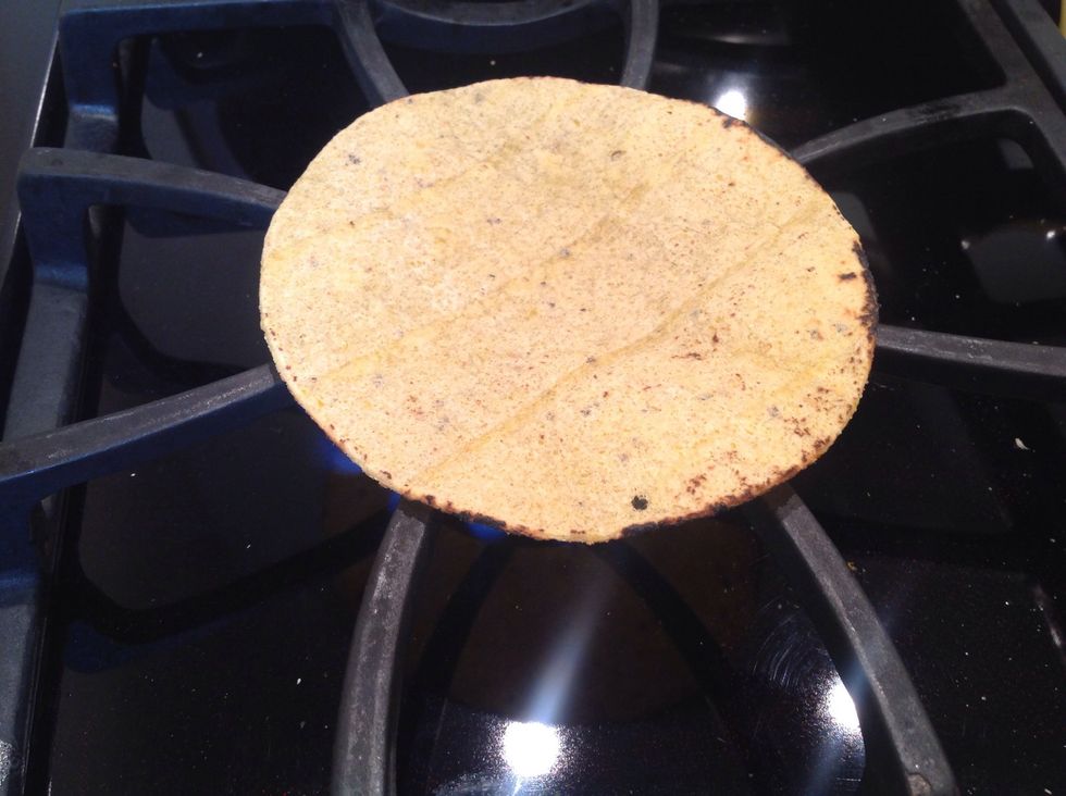 Warm your flour or corn tortillas. I put them directly on the gas range for a few seconds until slightly blackened and then carefully flip them. Use tongs if you do this so as not to get burned.