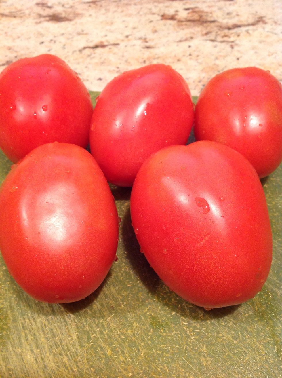 Wash about 3 tomatoes.