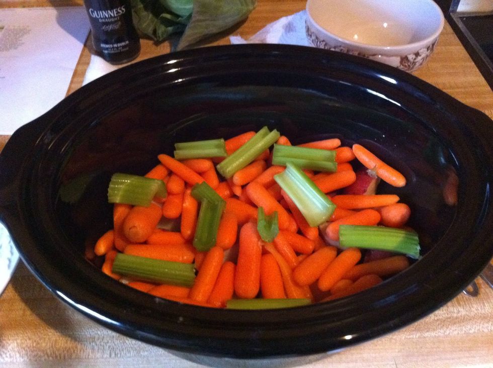 Wash and chop 2 ribs of celery into 2-3 inch pieces; add to crock pot