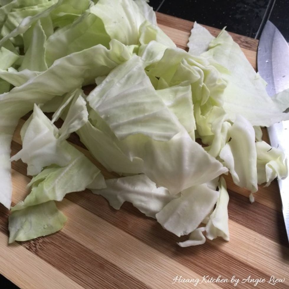 Wash and cut cabbage into thick pieces.