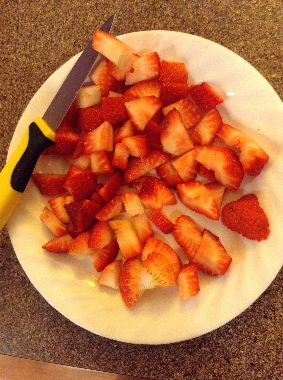 Wash and cut up 4 strawberries