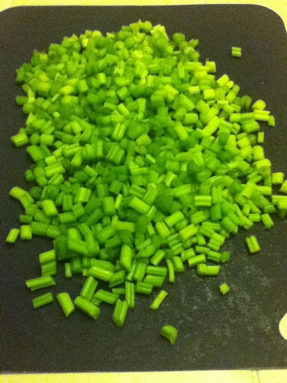 Wash and dry the celery.  Then, dice it into small pieces, less than the size of a fingernail if you have the patience.  Again, the smaller you cut it now, the nicer your texture will be later.