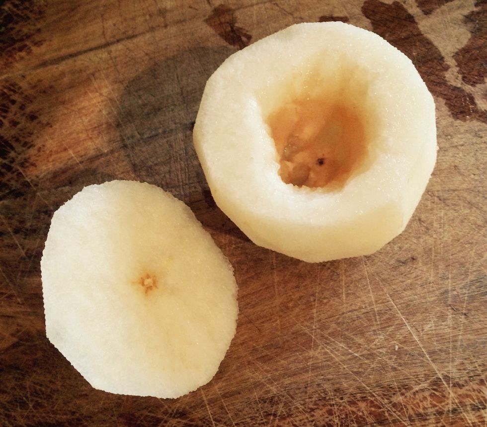 Wash and dry the pear. Peel the pear. Cut off the top of the pear. Remove the pear core and seeds carefully.