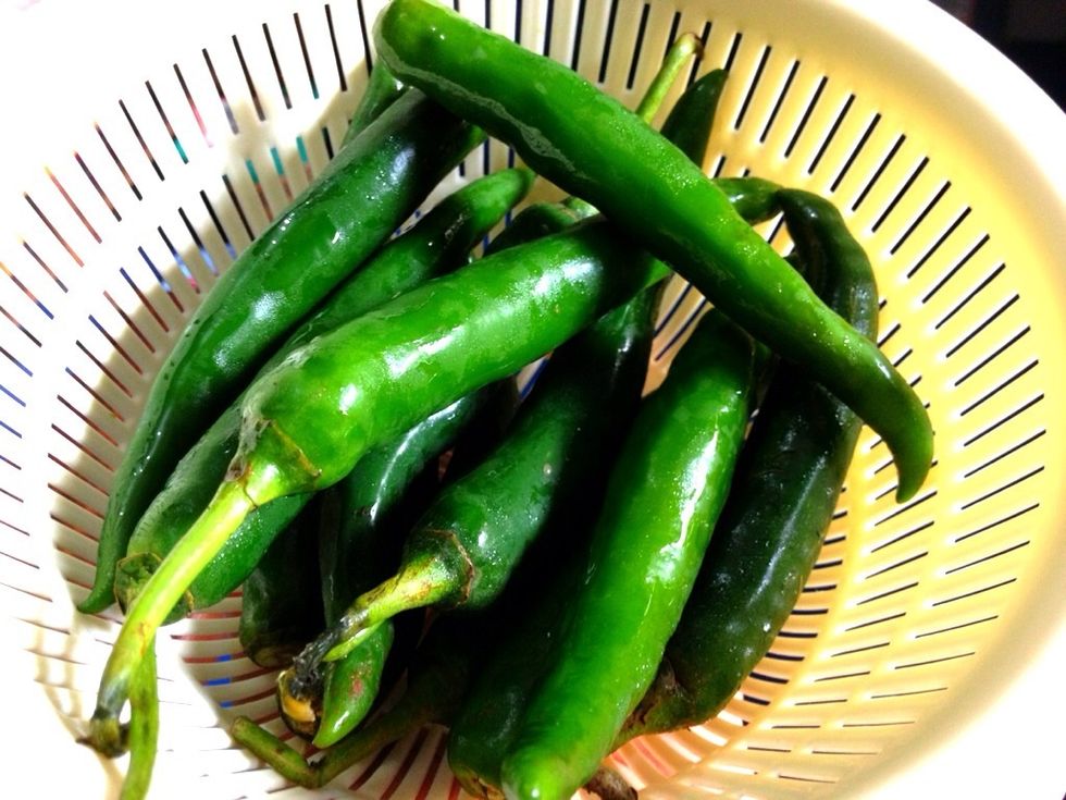 Wash and pat dry 200 gr of green chilies Green chilies are less spicy than the red ones. Remove seeds if you dont like it too spicy