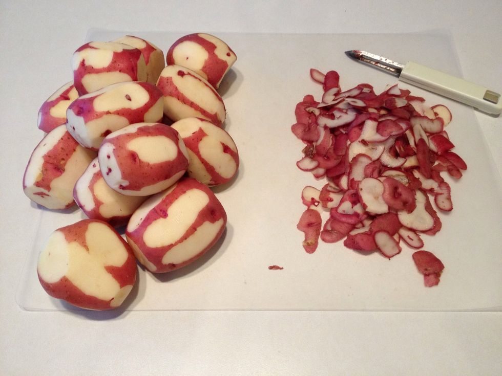 Wash and pat dry potatoes. Roughly peel potatoes, leaving some skin attached.