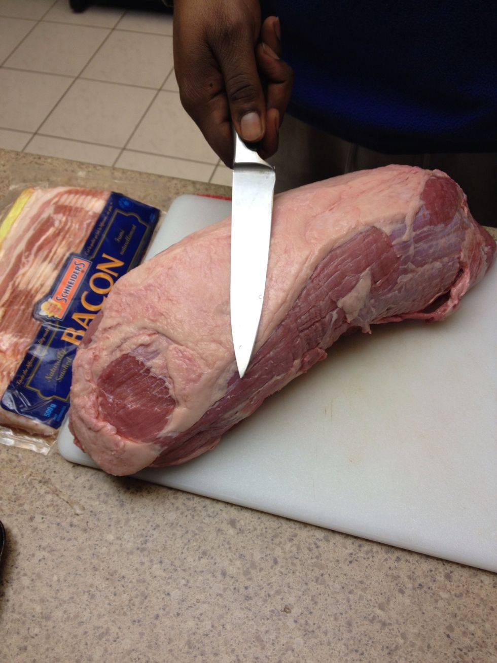 Wash and pat dry your beef roast. Cut off most of the fat and put it aside. Cut the roast in to smaller workable sections. I cut this one into four chunks.