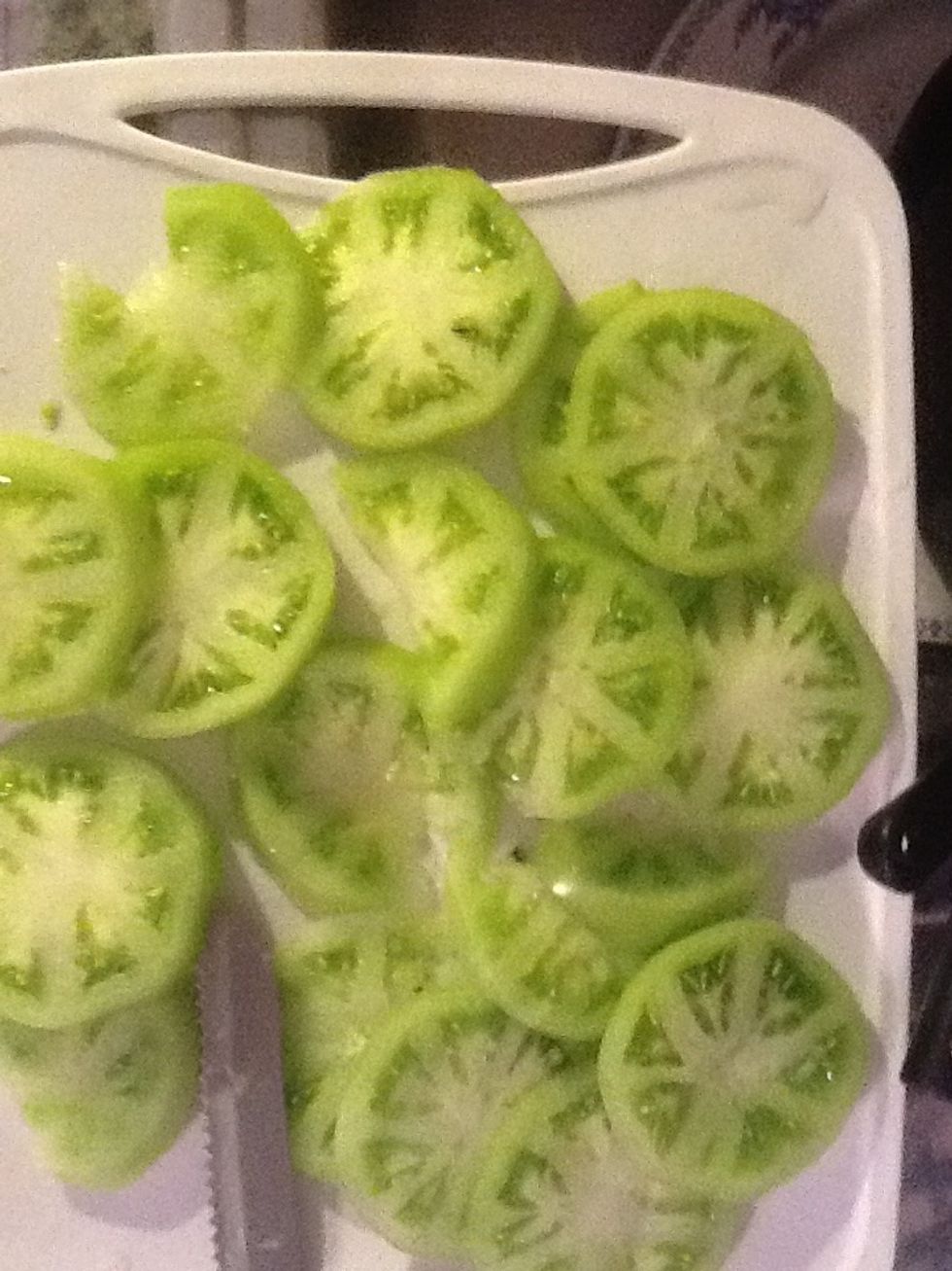 Wash and slice your tomato to desired thickness. Gather ingredients. Lightly season green tomatoes. Heat oil to 350 degrees.