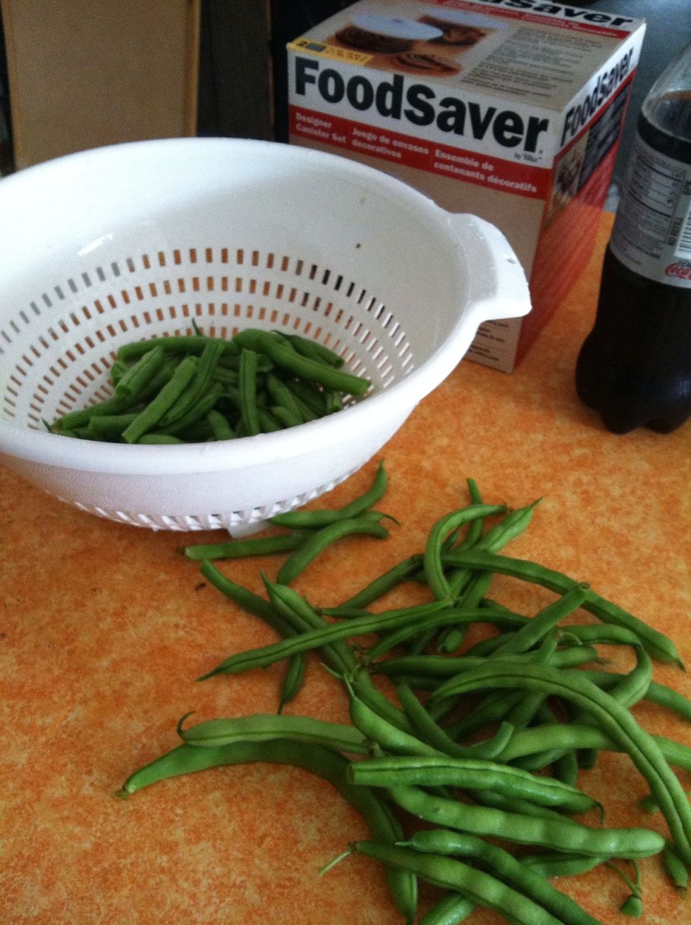 Wash and snap off stems. Cut or break in half if your beans are real long