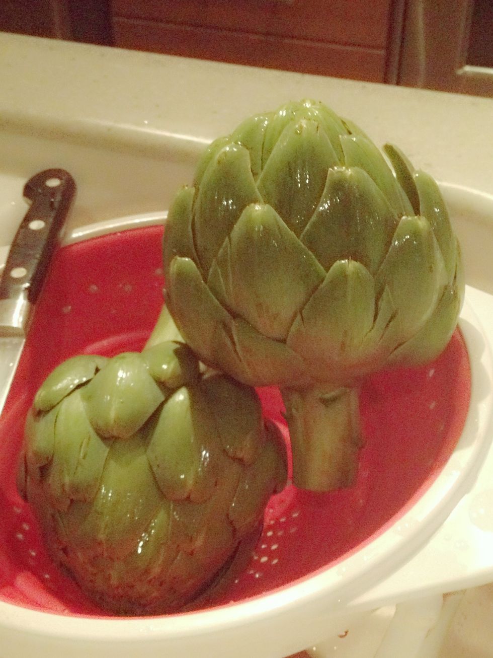 Wash artichokes