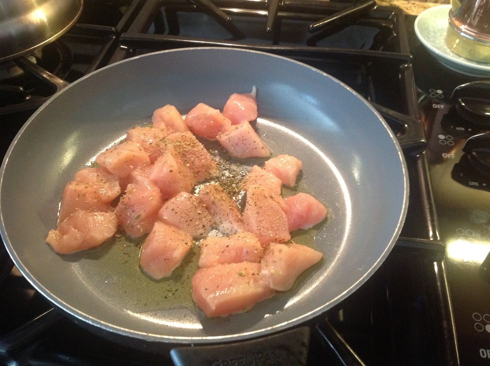 Wash chicken and cut up into little chunks. Add salt, pepper, and oregano seasoning