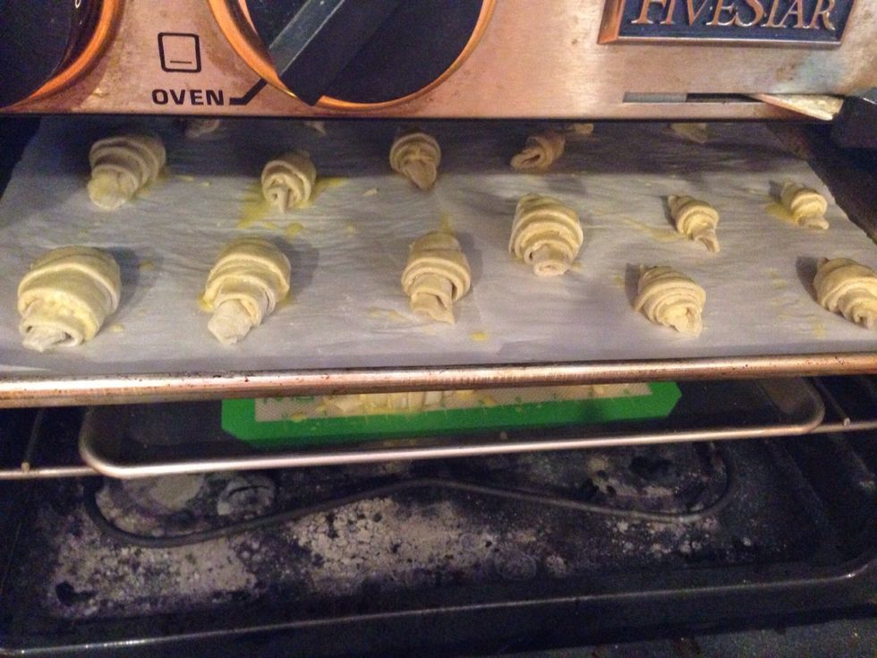 Wash croissants with egg, and bake in an oven preheated to 400 degrees Fahrenheit, until golden brown. Watch carefully!