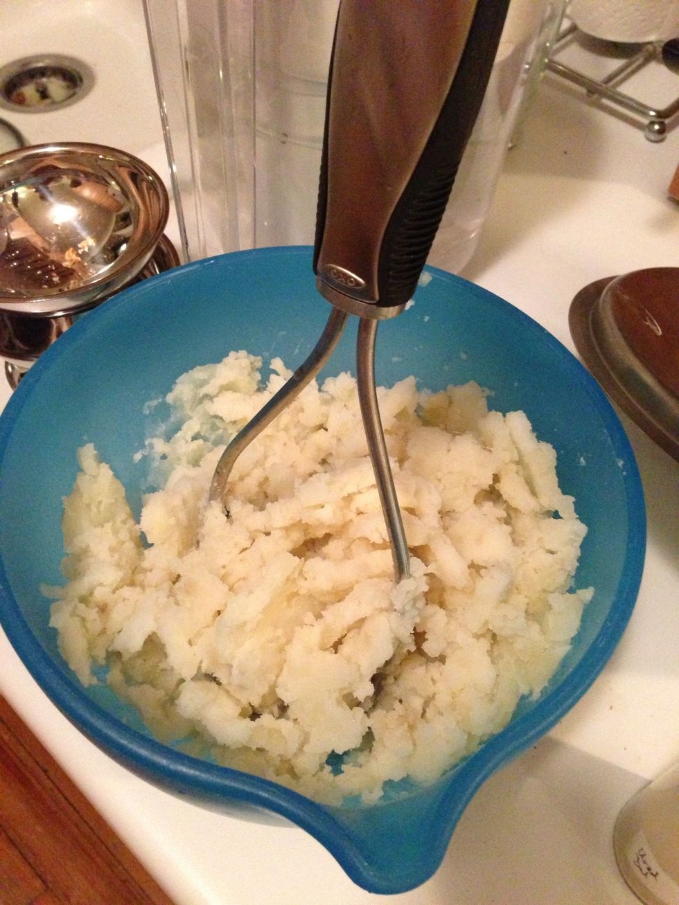 Wash, cut into cubes, boil, peel and then mash 2 medium sized potatoes