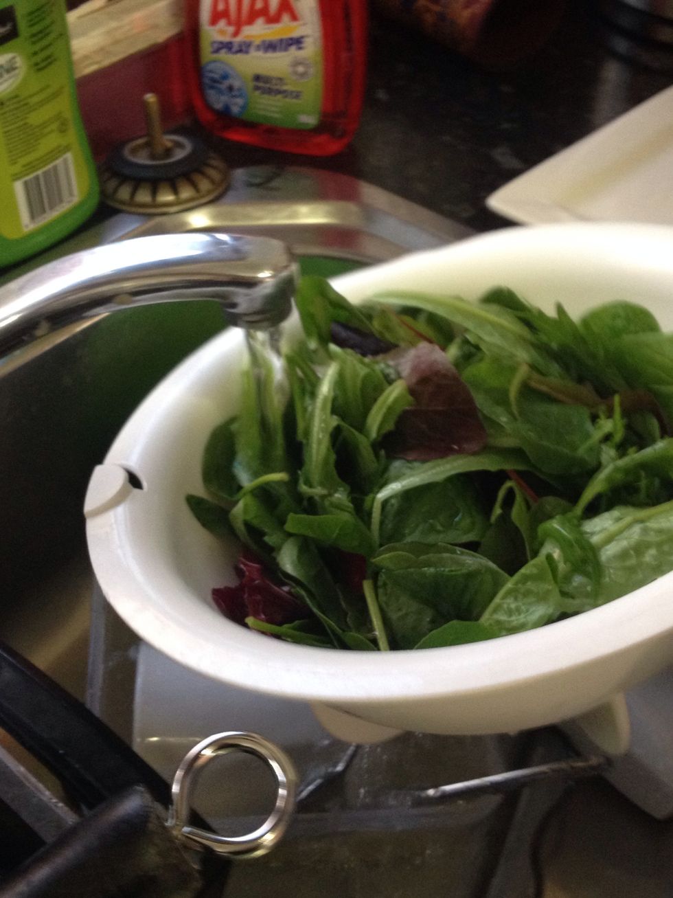 Wash green cos lettuce, red cos lettuce and beetroot leaves. Then place in bowl.