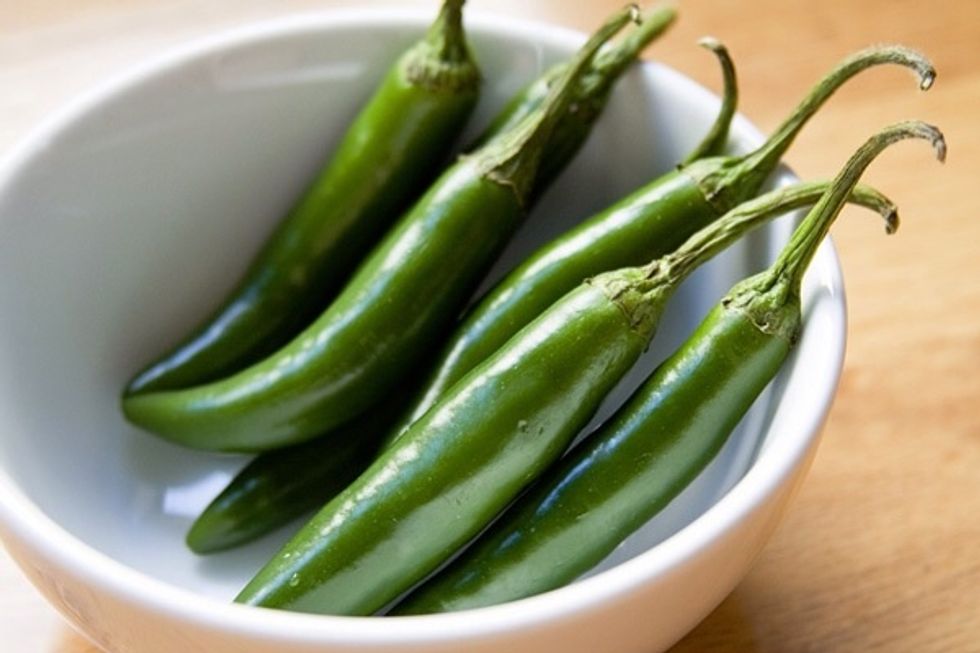 (Wash it) Take off the stem from the green chiles (all).