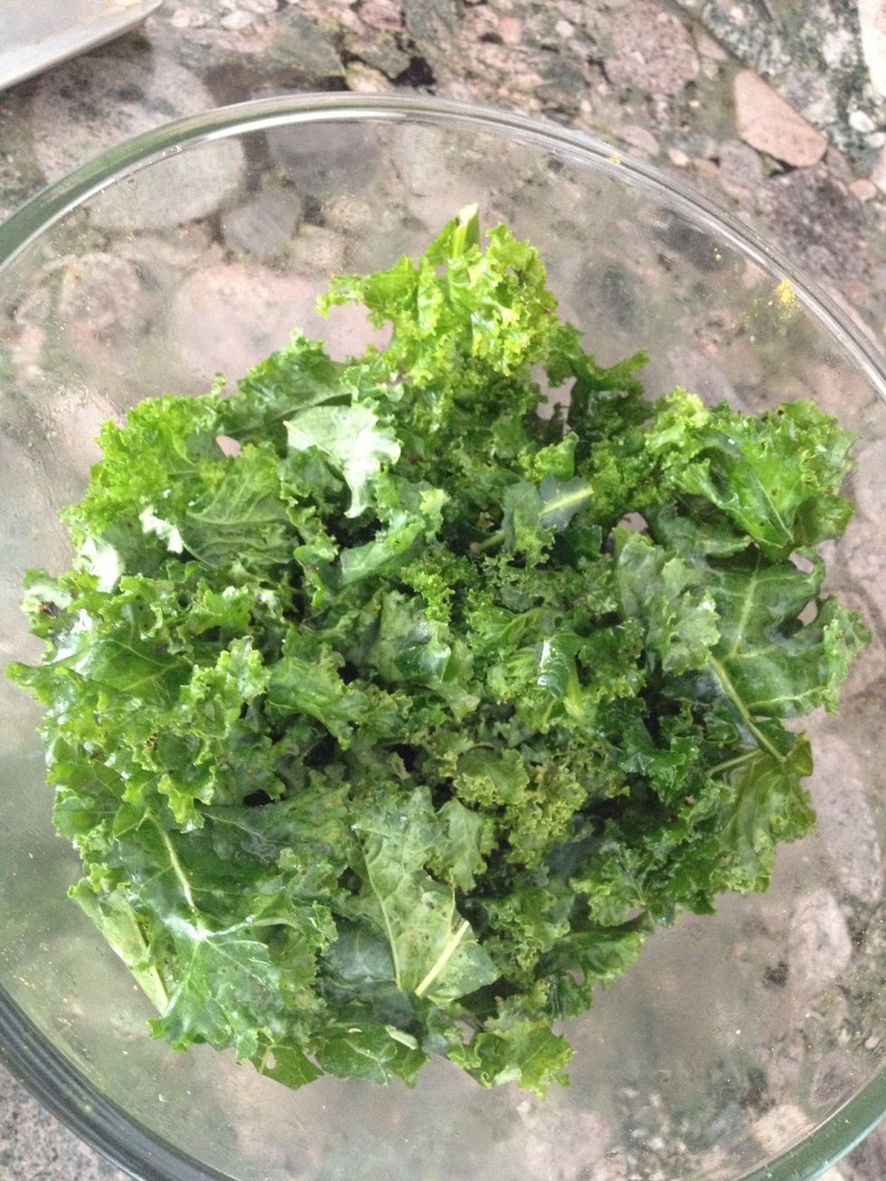 Wash kale and dry thoroughly. If you buy bagged organic you can skip this step which is less time consuming. Place absolutely bone dry kale in bowl.