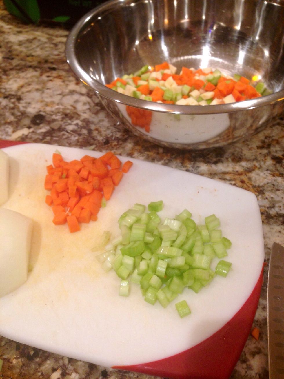 Wash, peel and chop your carrots, celery, onion (and parsnips if using).   Pieces should be no larger than 1/4 inch.  (Keep them smaller than bite size.)