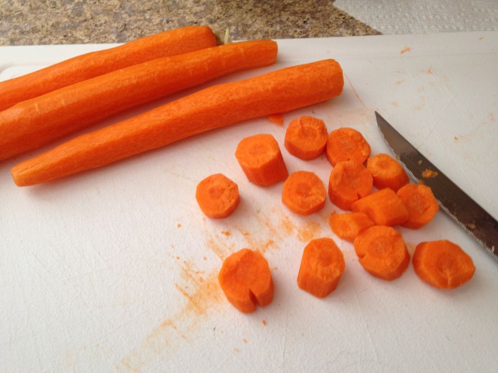 Wash, peel, and slice carrots into 1/2 inch thick rounds.