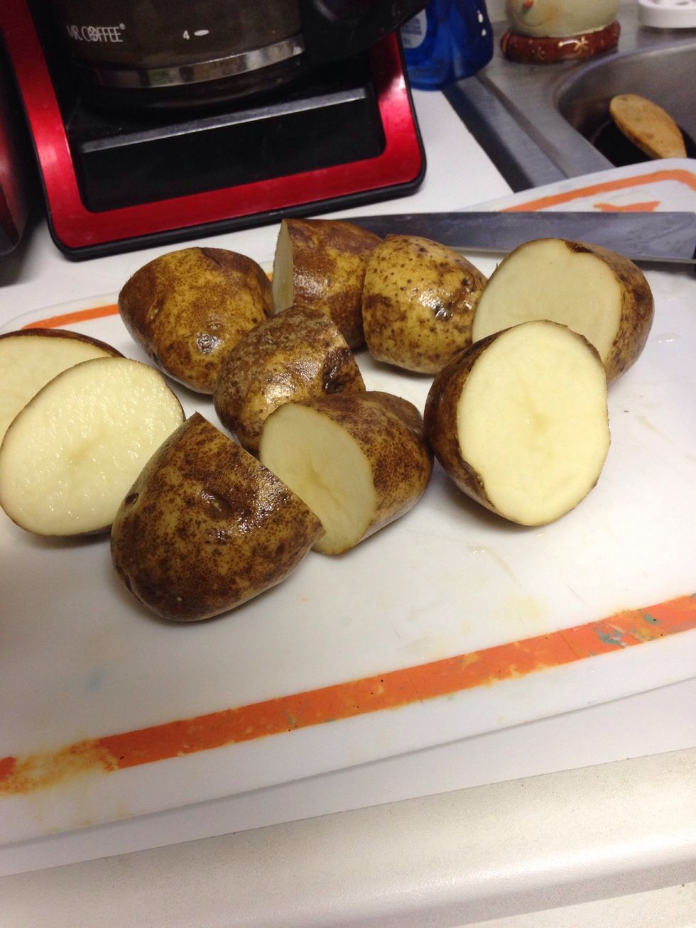 Wash potatoes and cut in half