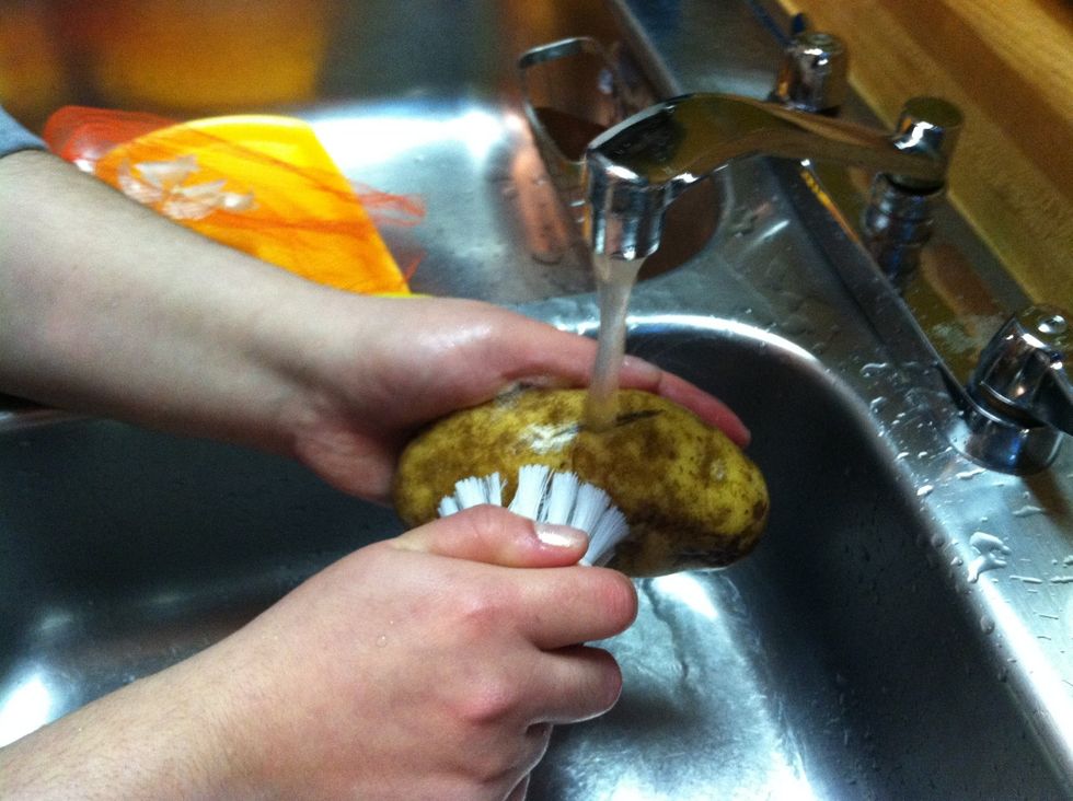 Wash potatoes with a potato brush to remove dirt & 'eyes'.