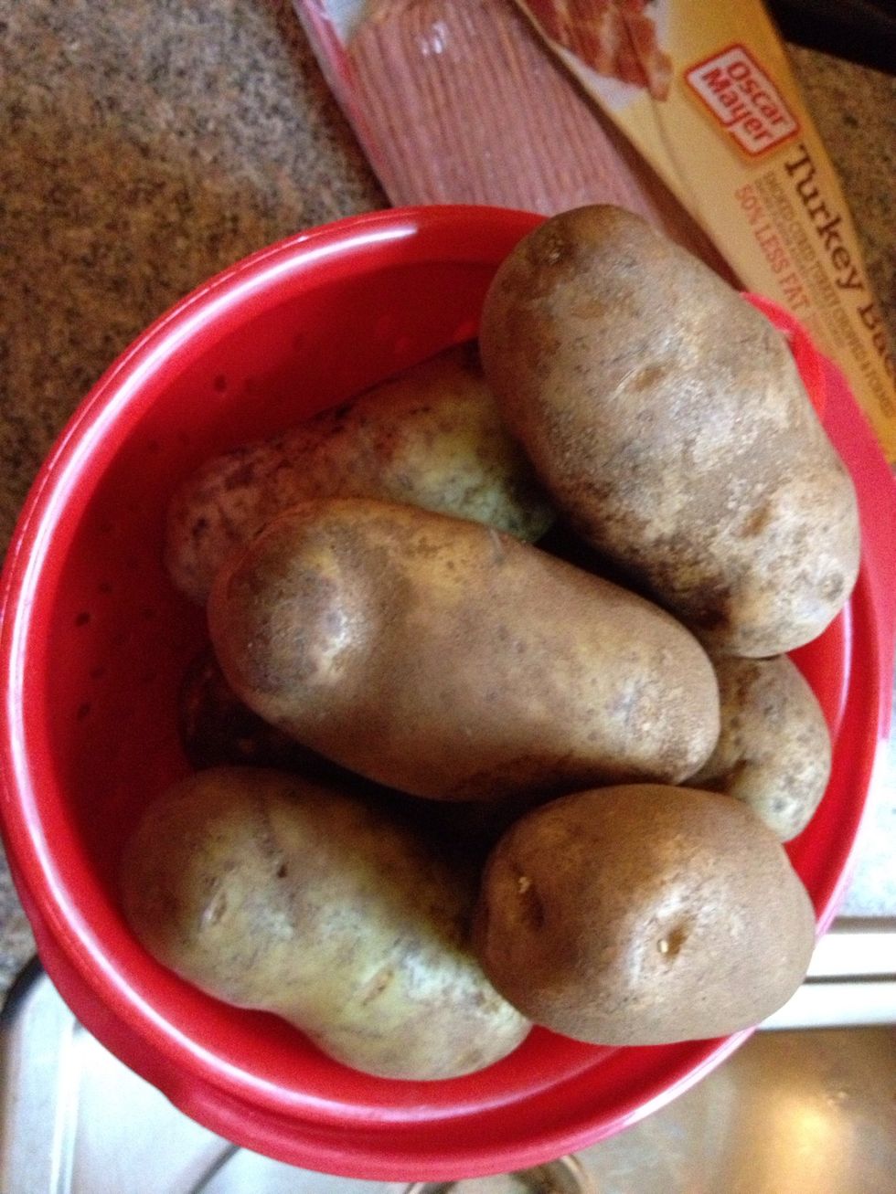 Wash potatoes
