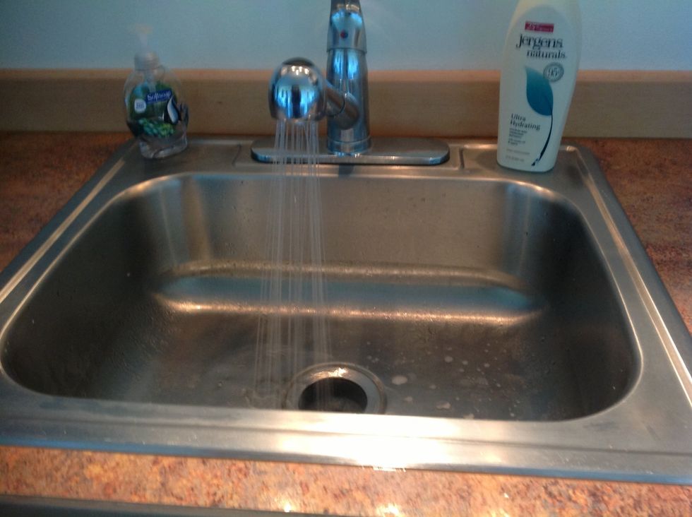 Wash romaine leaves and tomatoes.