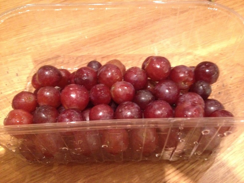 Wash some grapes and take them all off the stalks. Place them in the freezer for at least a few hours. I just leave some in there to have a few when I want them